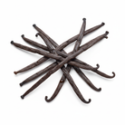 6 vanilla beans in a scattered pile