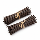 Two horizontal vanilla bean bundles with twine