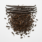 Whole vanilla beans on top of broken pieces